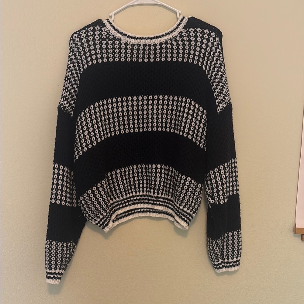 Black and White Crew Neck Sweater with Striking Patterns